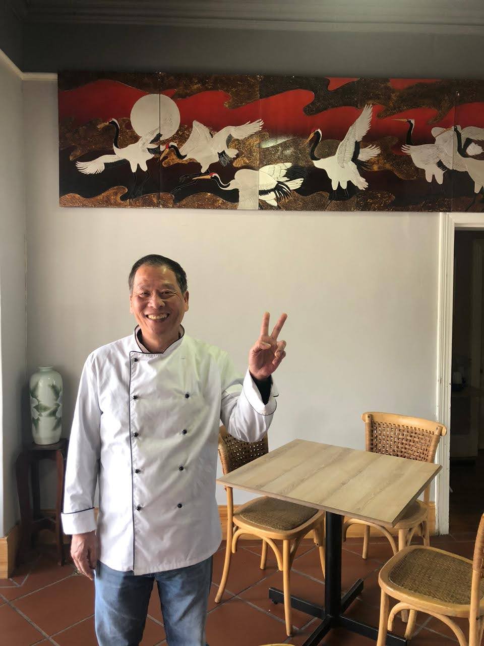 Chef Guo standing in Blue Waters restaurant.